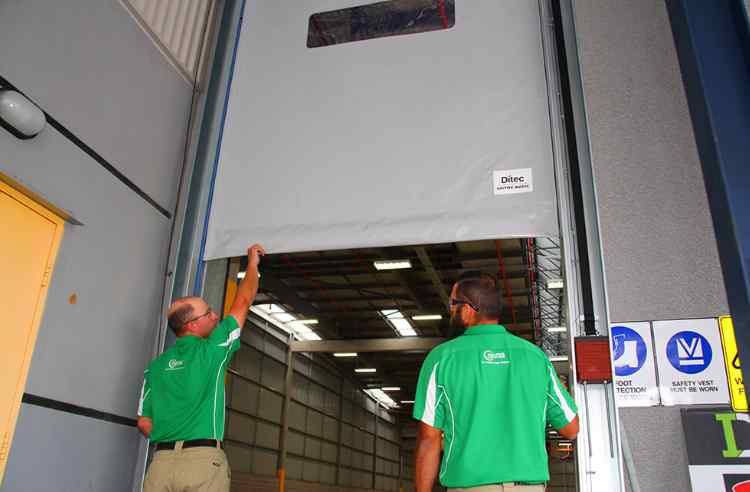 High-Speed rapid roller door being installed by two technicians.