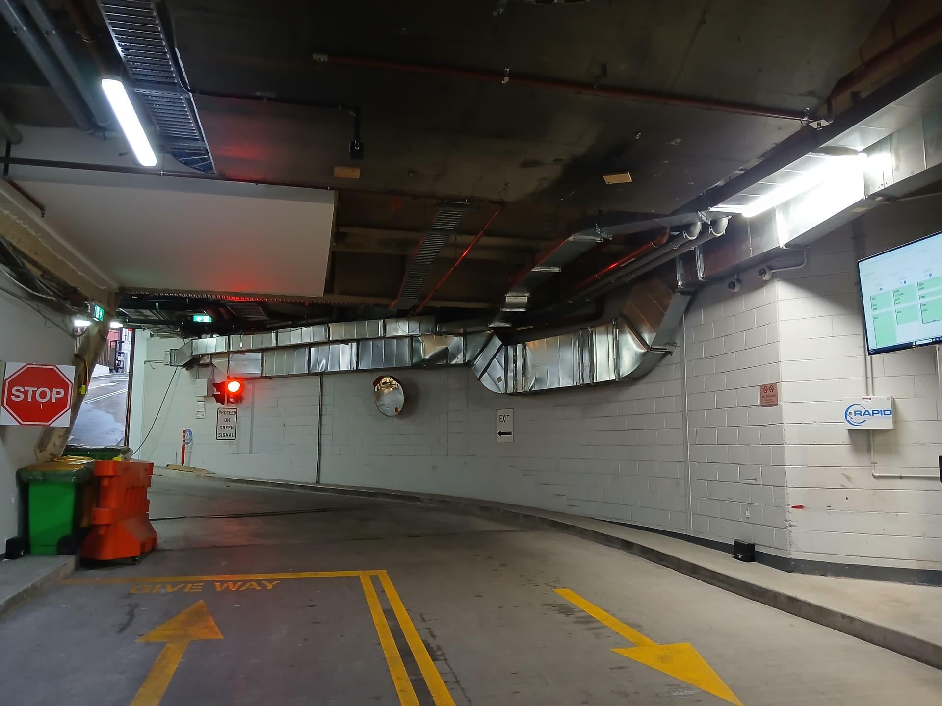 Rapid access control system managing signals at an underground car park exit.